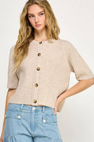 Beige button up the front sweater. 1/2 sleeve.