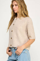 Beige button up the front sweater. 1/2 sleeve.