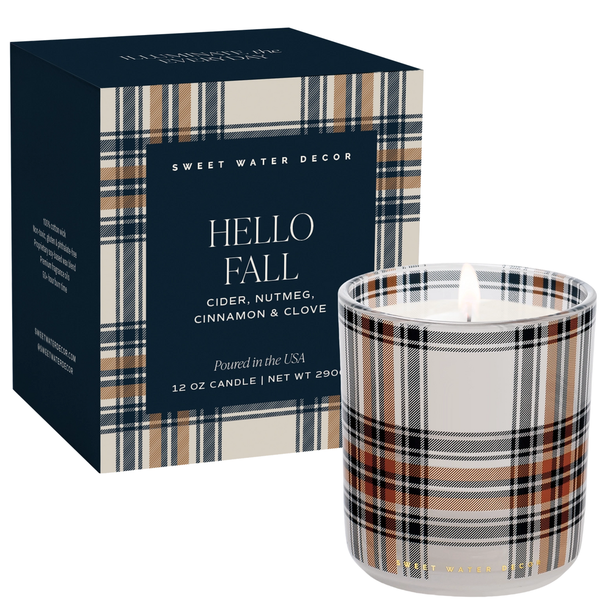 A lit 12 oz candle in a white glass jar with a beige, navy, black, and brown plaid pattern, shown next to its navy blue box featuring matching plaid trim. The brand 'Sweet Water Decor' is visible on both the box and the candle.