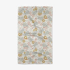 Floral patterned rug with flowers and leaves on a light background