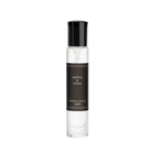 Perfume bottle with black cap and label on a white background
